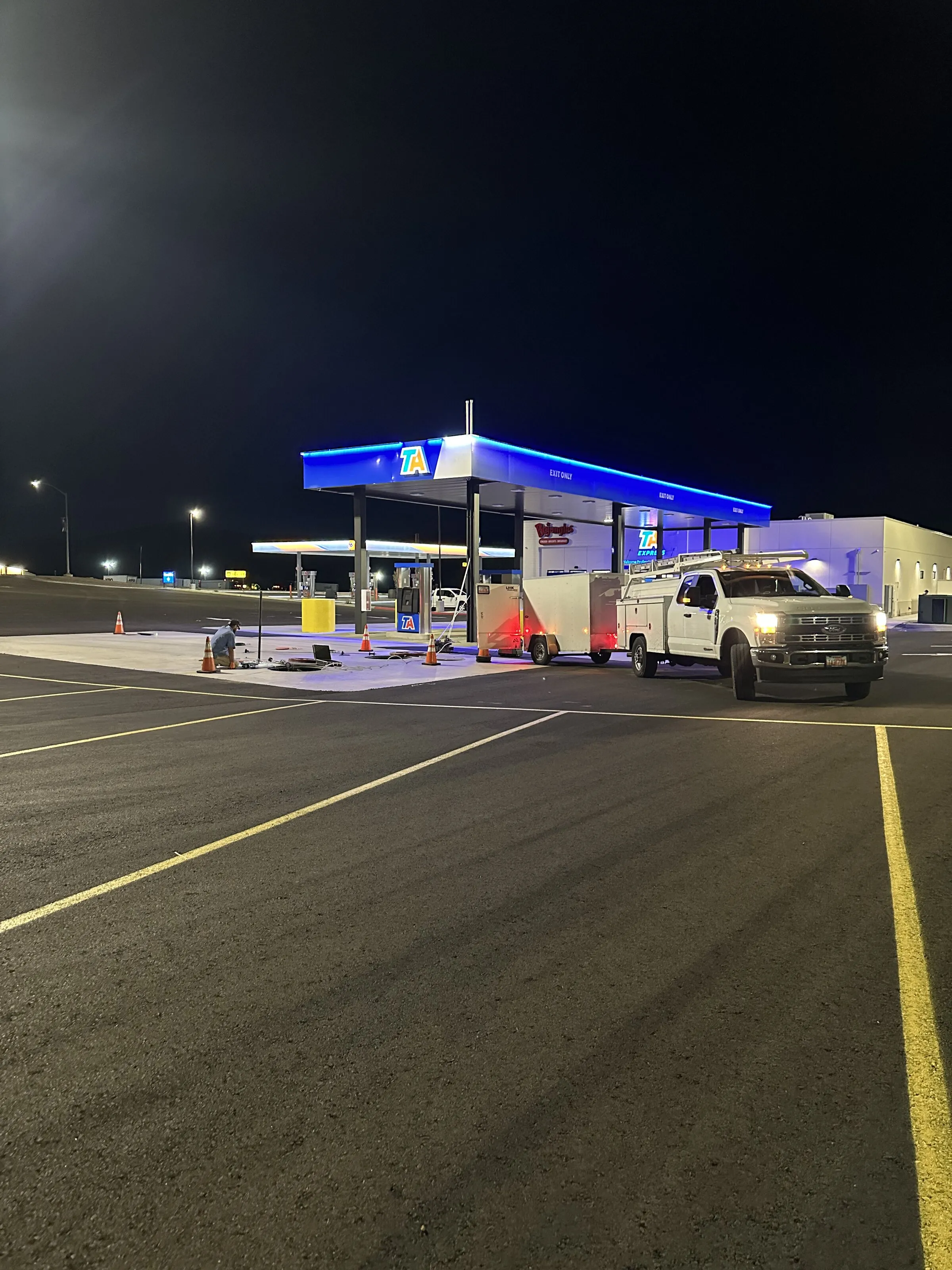 Precision Testing Technologies service truck and crew on site at a fuel station performing UST compliance testing in the Intermountain West.